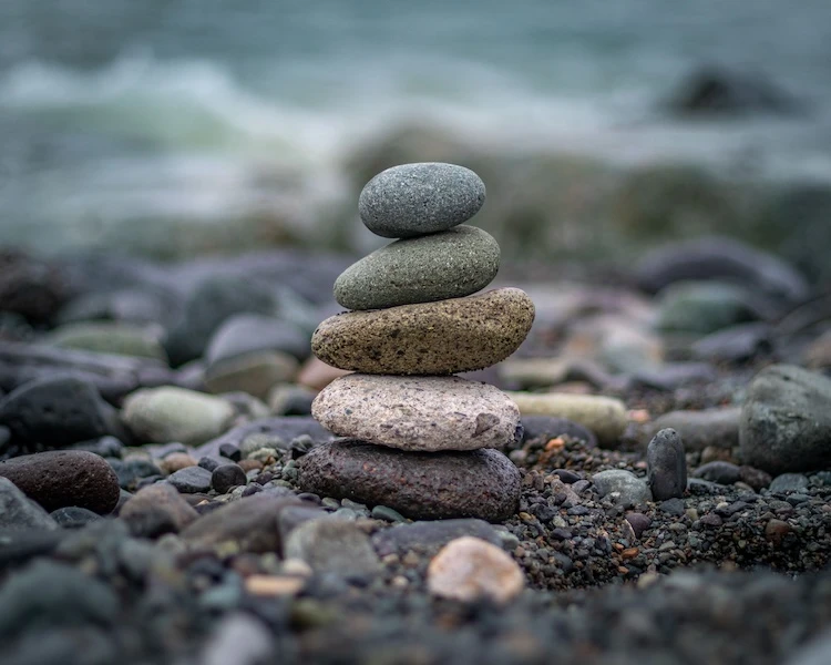 A stack of rocks next to the sea.